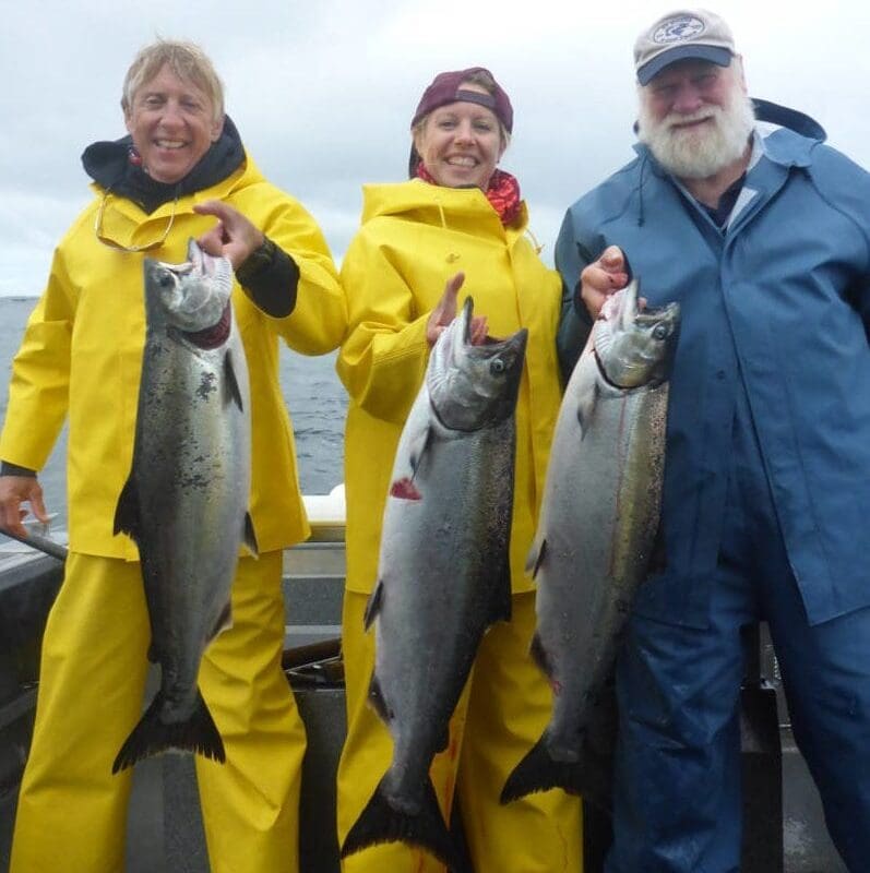 Angling Unlimited guests hold salmon