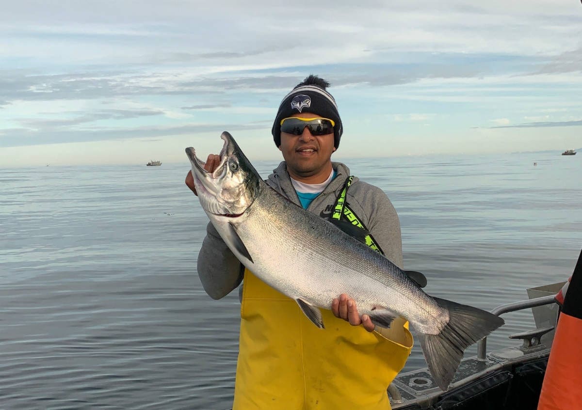 large silver salmon caught on calm Sitka waters by AU customer
