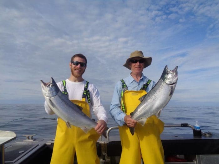 Kevin and Mark Brashem with a pair of early August coho with Angling Unlimited in Sitka, AK