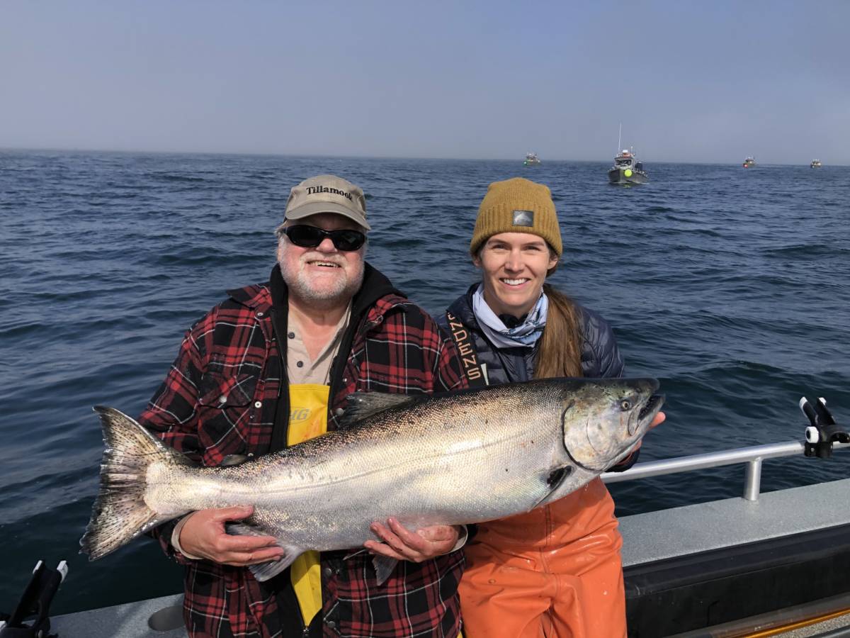 Angling Unlimited guest and crew member Sarah Farber hold king salmon