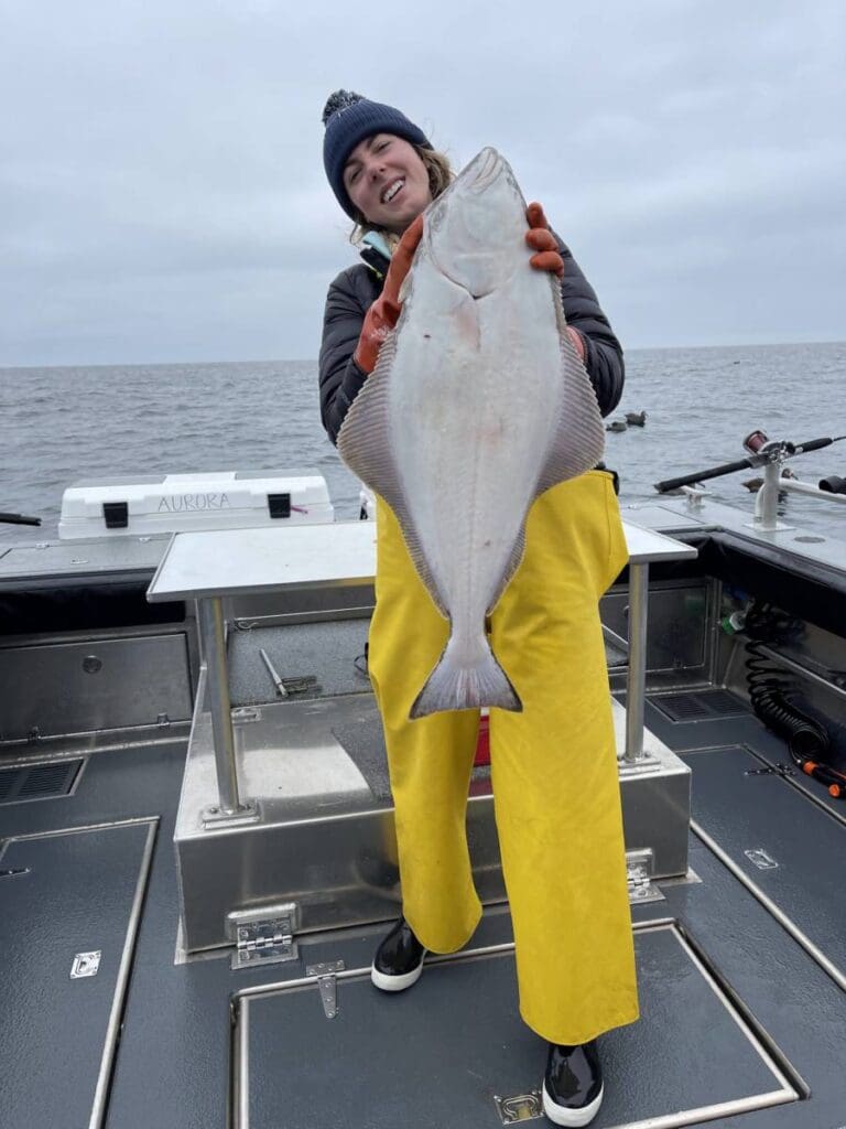 Angling Unlimited guest holds an Alaskan halibut