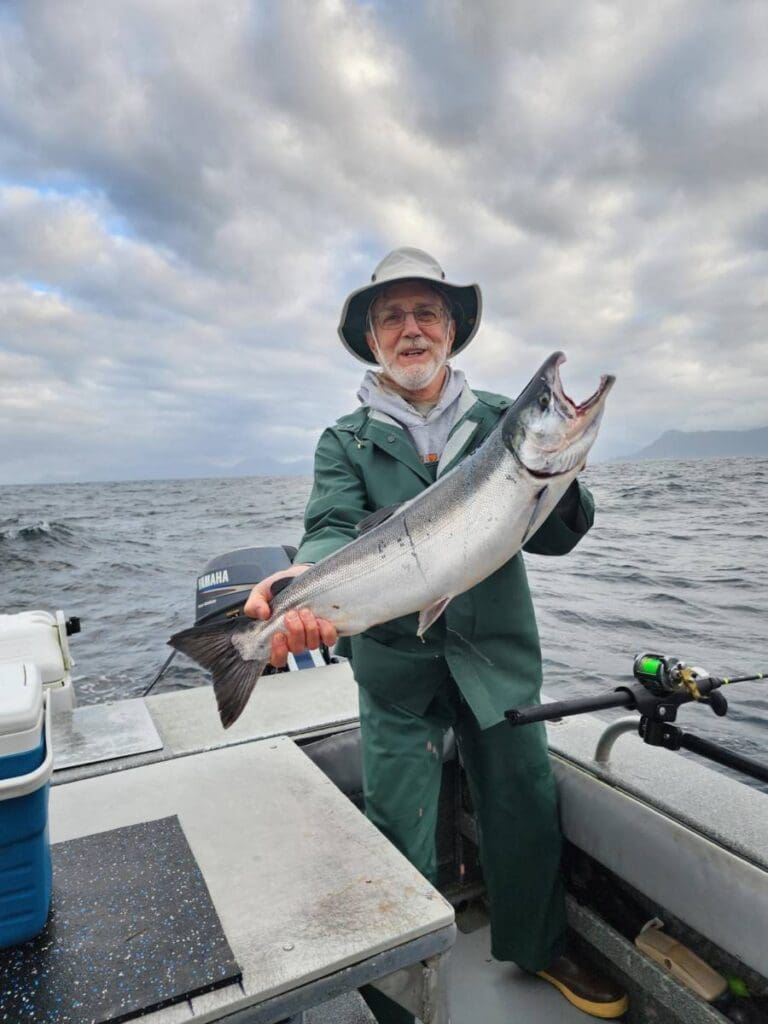 Angling Unlimited guest with Alaskan silver salmon